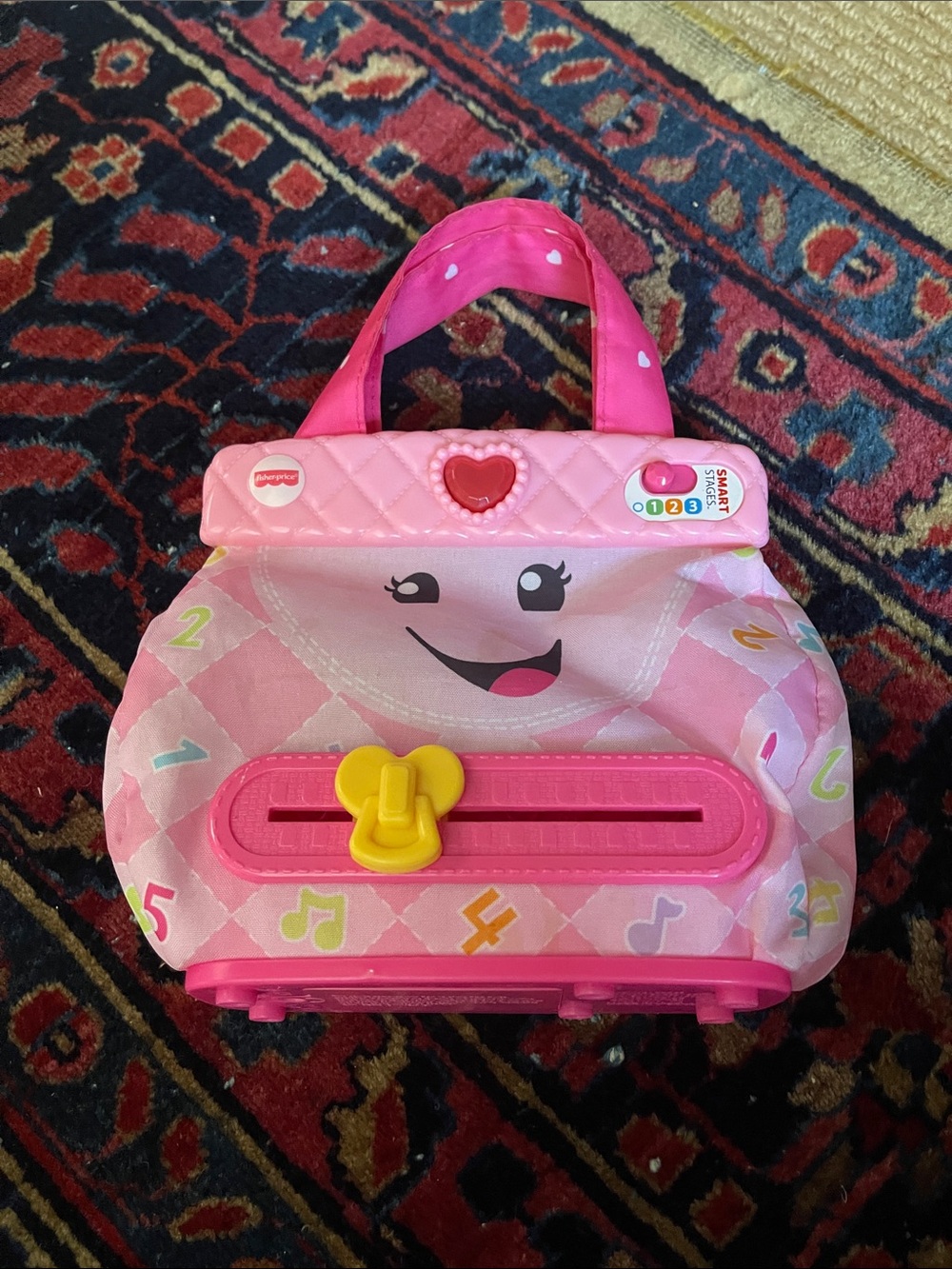 Fisher-Price Pink Musical Learning Purse with Smile Face